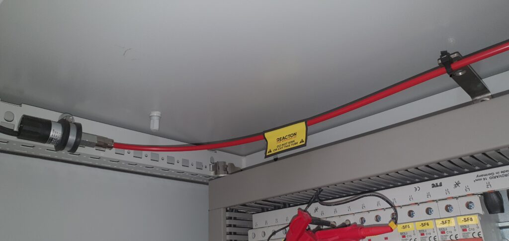 Close-up of fire suppression detection system and signal relay installed in electrical control panel